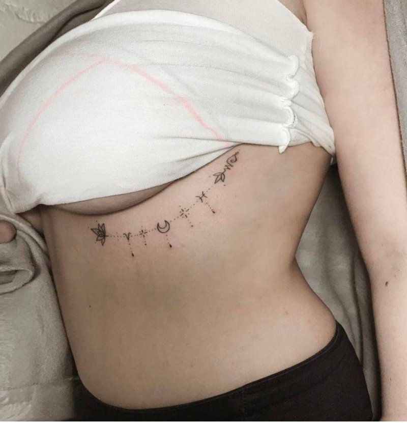 Тату под ребром у девушек